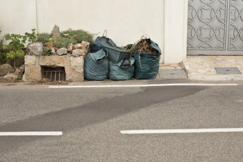 Waste being loaded for removal at a mixed-use property in Purfleet